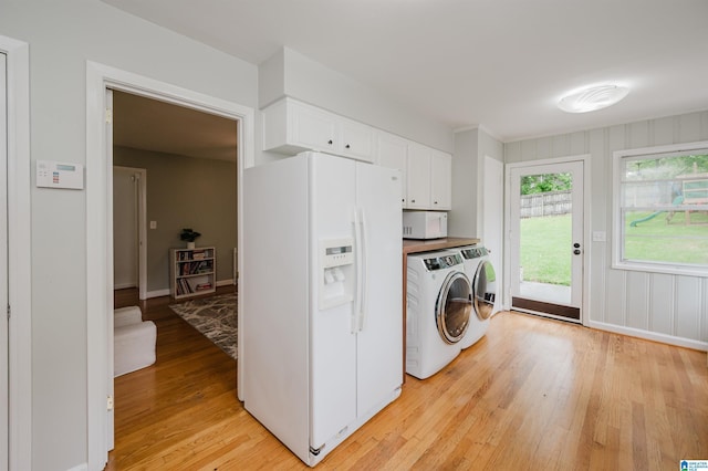 1718 Windsor Blvd, Homewood, AL 35209 - laundry area with washer and clothes dryer, light wood-style floors, and baseboards
