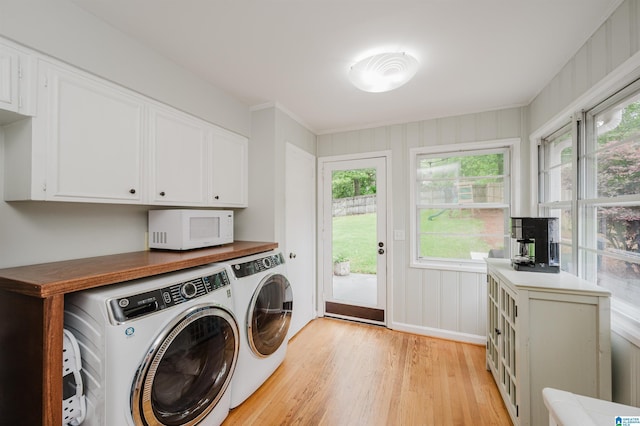 1718 Windsor Blvd, Homewood, AL 35209 - laundry area with separate washer and dryer, light wood-style flooring, and cabinet space