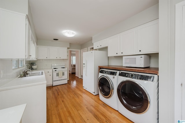 1718 Windsor Blvd, Homewood, AL 35209 - laundry room featuring washer and clothes dryer and light wood-style flooring