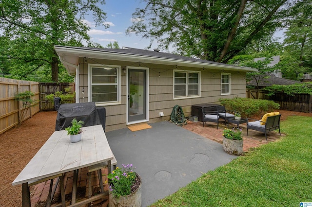 1718 Windsor Blvd, Homewood, AL 35209 - fenced backyard featuring a patio area, outdoor lounge area, a grill, and outdoor dining space
