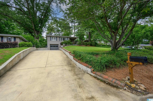 1718 Windsor Blvd, Homewood, AL 35209 - view of front of property with concrete driveway, a garage, and a front lawn