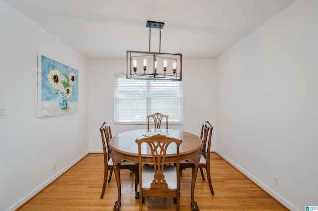 1718 Windsor Blvd, Homewood, AL 35209 - dining space with a chandelier, light wood finished floors, and baseboards