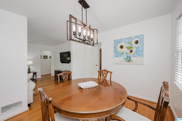 1718 Windsor Blvd, Homewood, AL 35209 - dining space with light wood-type flooring, a chandelier, and baseboards