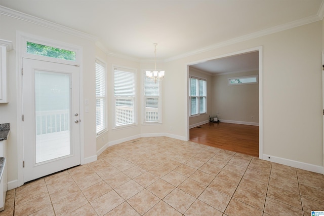 822 Boulder Ridge Cir, Hoover, AL 35244 - unfurnished dining area with a chandelier, light tile patterned flooring, crown molding, healthy amount of natural light, and baseboards