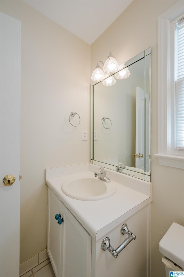 822 Boulder Ridge Cir, Hoover, AL 35244 - bathroom featuring vanity, toilet, plenty of natural light, and tile patterned floors