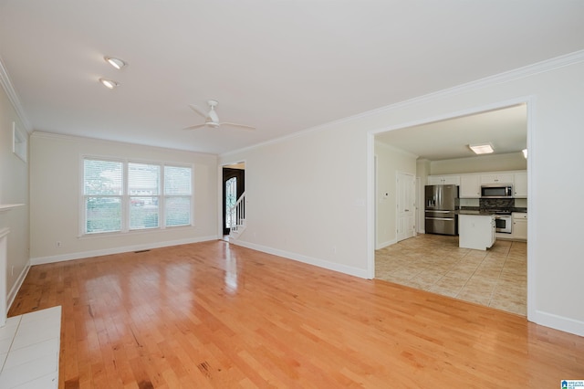 822 Boulder Ridge Cir, Hoover, AL 35244 - unfurnished living room with light wood-style floors, ceiling fan, crown molding, and baseboards