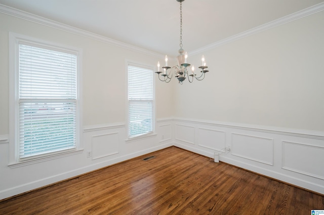822 Boulder Ridge Cir, Hoover, AL 35244 - spare room featuring a chandelier, wood finished floors, plenty of natural light, ornamental molding, and wainscoting