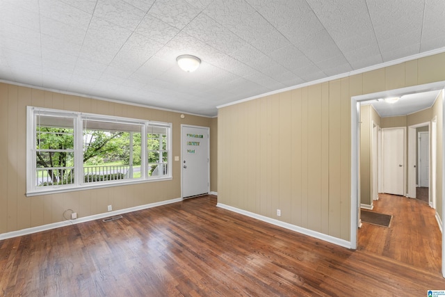 315 3rd Ave, Odenville, AL 35120 - empty room with wood finished floors, ornamental molding, baseboards, and wooden walls