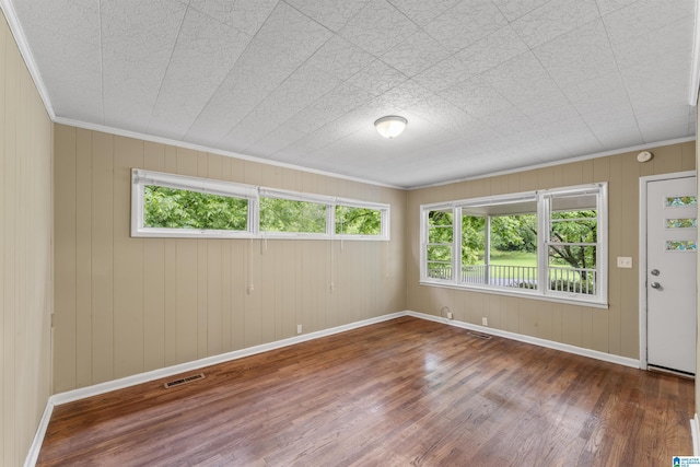 315 3rd Ave, Odenville, AL 35120 - spare room featuring wood finished floors, baseboards, and crown molding