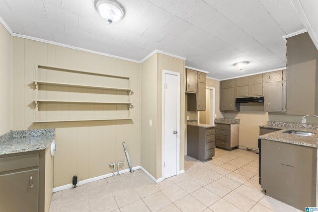 315 3rd Ave, Odenville, AL 35120 - kitchen featuring a sink, crown molding, light tile patterned flooring, baseboards, and light stone countertops