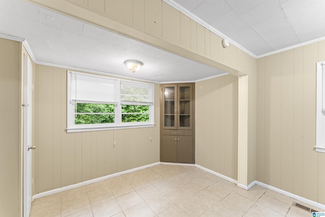 315 3rd Ave, Odenville, AL 35120 - spare room featuring crown molding, baseboards, light tile patterned floors, and a smoke detector