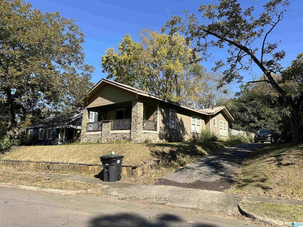 805 78th St S, Birmingham, AL 35206 - view of front of house with stone siding and driveway