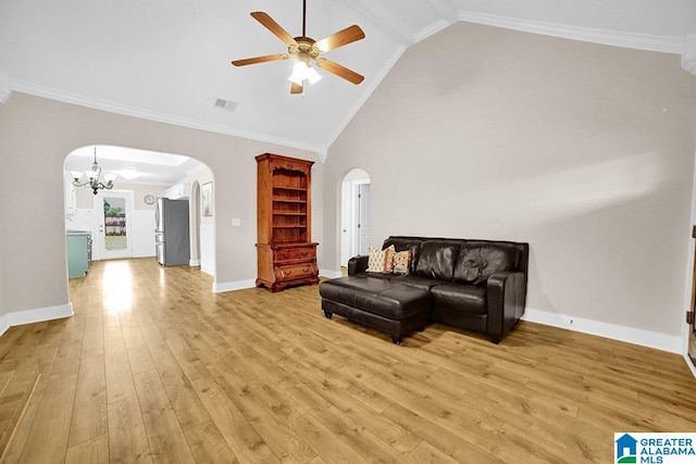 123 Whitestone Trl, Calera, AL 35040 - living area with arched walkways, ceiling fan, light wood finished floors, vaulted ceiling, and baseboards