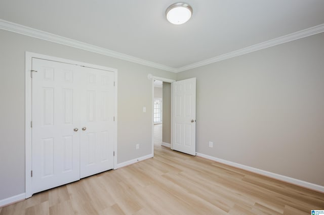 2019 Russet Meadows Ct, Helena, AL 35244 - unfurnished bedroom featuring light wood-type flooring, crown molding, a closet, and baseboards