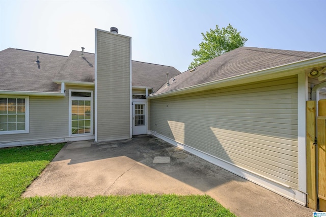 2019 Russet Meadows Ct, Helena, AL 35244 - back of house featuring a patio area, a chimney, and roof with shingles
