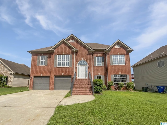 450 Bentmoor Way, Helena, AL 35080 - bi-level home with a garage, driveway, brick siding, and a front lawn