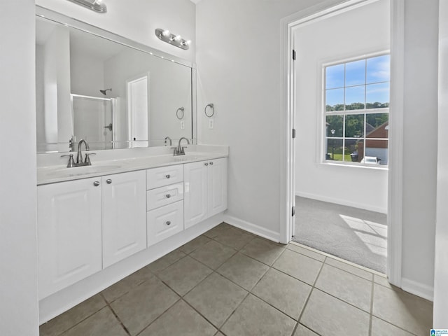 450 Bentmoor Way, Helena, AL 35080 - full bathroom featuring double vanity, a stall shower, tile patterned floors, and baseboards