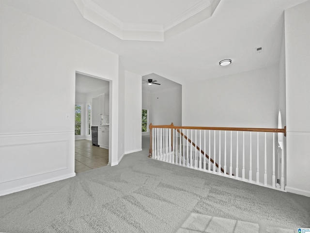 450 Bentmoor Way, Helena, AL 35080 - empty room featuring carpet, a tray ceiling, ornamental molding, a ceiling fan, and tile patterned flooring