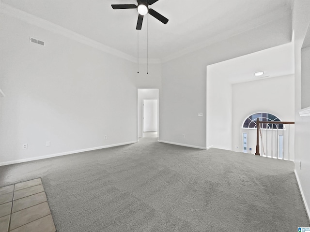 450 Bentmoor Way, Helena, AL 35080 - unfurnished living room featuring a ceiling fan, carpet, baseboards, ornamental molding, and a towering ceiling