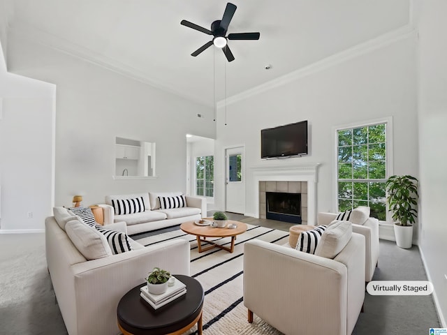 450 Bentmoor Way, Helena, AL 35080 - living room featuring ceiling fan, crown molding, plenty of natural light, a tile fireplace, and a high ceiling