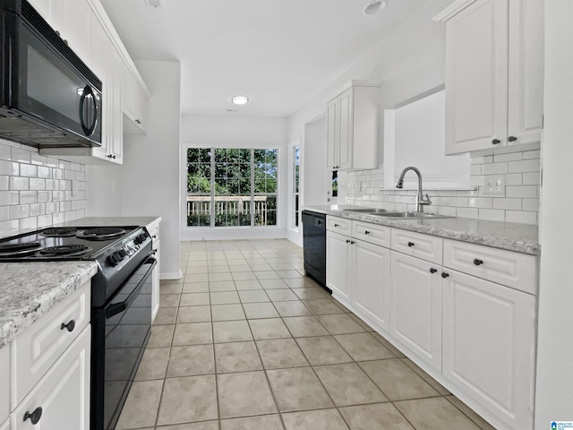 450 Bentmoor Way, Helena, AL 35080 - kitchen featuring black appliances, a sink, baseboards, light tile patterned floors, and white cabinetry