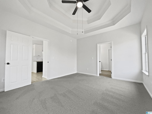450 Bentmoor Way, Helena, AL 35080 - carpeted spare room featuring ceiling fan, a tray ceiling, baseboards, and crown molding
