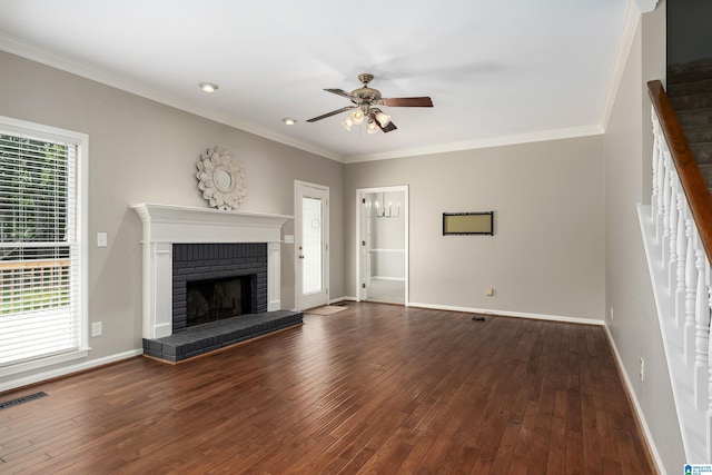 100 Redwood Dr, Trussville, AL 35173 - unfurnished living room featuring a ceiling fan, wood-type flooring, a fireplace, and crown molding