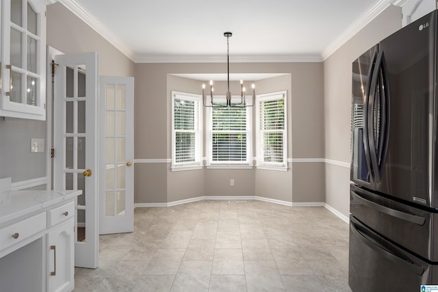 100 Redwood Dr, Trussville, AL 35173 - unfurnished dining area featuring a chandelier, ornamental molding, and french doors
