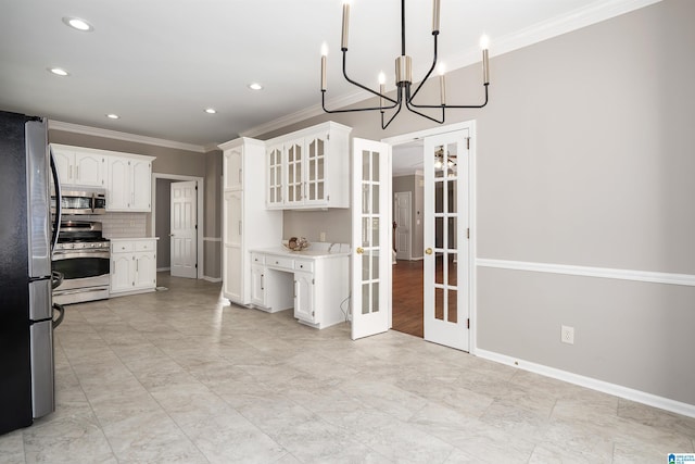 100 Redwood Dr, Trussville, AL 35173 - kitchen with appliances with stainless steel finishes, french doors, crown molding, white cabinets, and light countertops