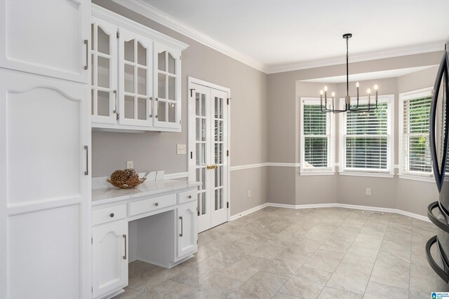 100 Redwood Dr, Trussville, AL 35173 - unfurnished dining area with a chandelier, french doors, and ornamental molding