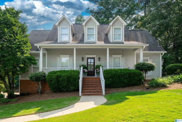 100 Redwood Dr, Trussville, AL 35173 - cape cod-style house with covered porch, a front lawn, and roof with shingles