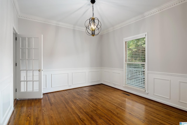 100 Redwood Dr, Trussville, AL 35173 - empty room featuring a chandelier, ornamental molding, wainscoting, and wood finished floors