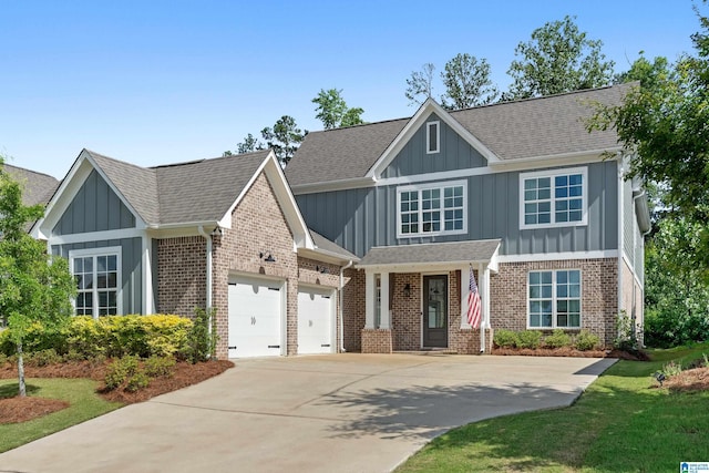 1982 Cyrus Cove Dr, Hoover, AL 35244 - view of front of house with board and batten siding, a garage, driveway, and brick siding