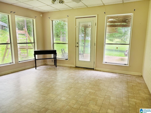 1315 Gloria Ln, Weaver, AL 36277 - doorway featuring a drop ceiling, baseboards, and brick patterned floors