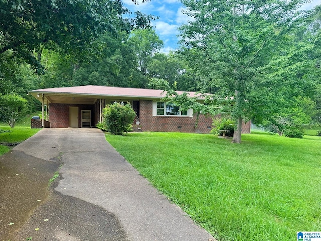 1315 Gloria Ln, Weaver, AL 36277 - single story home featuring driveway, a front yard, brick siding, and a carport