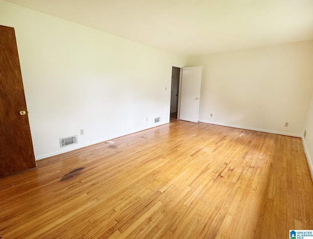 1315 Gloria Ln, Weaver, AL 36277 - empty room with light wood-style floors and baseboards
