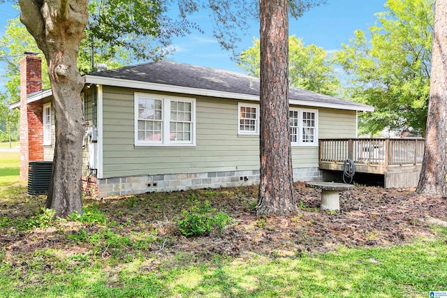 1693 4th Ave N, Clanton, AL 35045 - rear view of house with a wooden deck and central AC unit