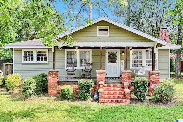 1693 4th Ave N, Clanton, AL 35045 - bungalow-style house featuring a porch and a chimney