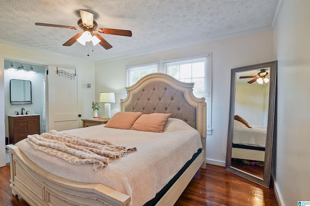 1693 4th Ave N, Clanton, AL 35045 - bedroom with dark wood-style flooring, ornamental molding, a textured ceiling, ceiling fan, and baseboards