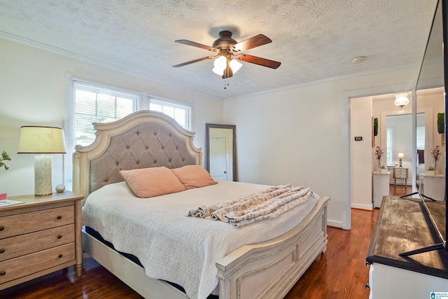1693 4th Ave N, Clanton, AL 35045 - bedroom with dark wood-style floors, ornamental molding, a textured ceiling, and ceiling fan