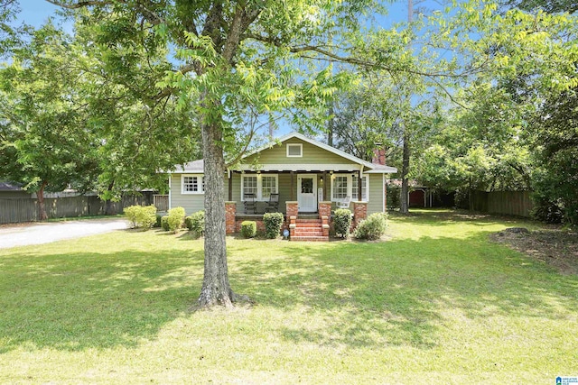 1693 4th Ave N, Clanton, AL 35045 - view of front of house featuring covered porch and a chimney