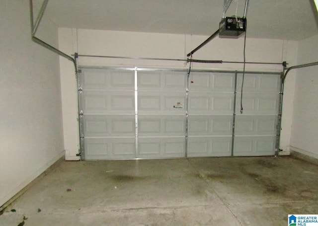 221 High Ridge Dr, Pelham, AL 35124 - garage featuring a garage door opener and baseboards
