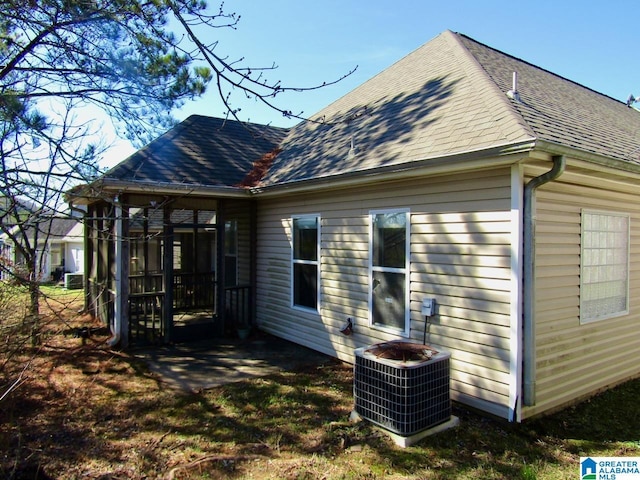 221 High Ridge Dr, Pelham, AL 35124 - view of home's exterior with central AC and a shingled roof