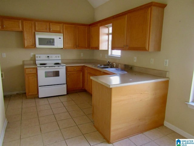 221 High Ridge Dr, Pelham, AL 35124 - kitchen featuring white appliances, lofted ceiling, light countertops, a peninsula, and a sink