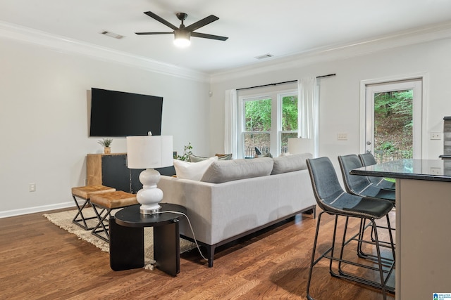 1033 Inverness Cove Way, Hoover, AL 35242 - living area with ceiling fan, crown molding, healthy amount of natural light, dark wood-style flooring, and baseboards