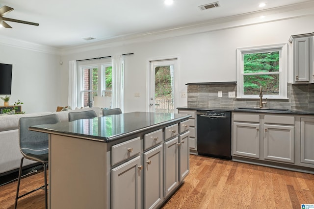 1033 Inverness Cove Way, Hoover, AL 35242 - kitchen featuring dishwasher, gray cabinetry, ornamental molding, a kitchen bar, and a sink