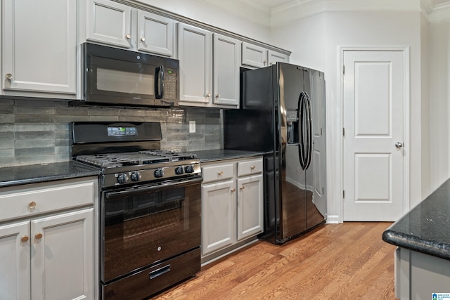 1033 Inverness Cove Way, Hoover, AL 35242 - kitchen with black appliances, crown molding, light wood finished floors, backsplash, and dark stone counters