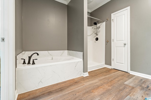 1033 Inverness Cove Way, Hoover, AL 35242 - full bathroom with ornamental molding, walk in shower, a bath, wood finished floors, and baseboards