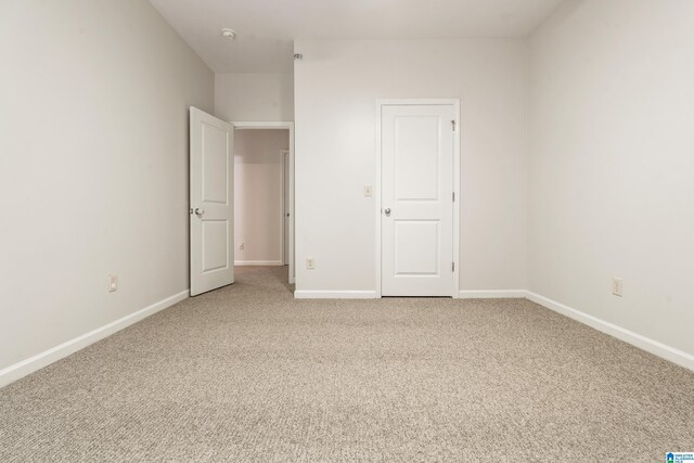 1033 Inverness Cove Way, Hoover, AL 35242 - unfurnished bedroom featuring carpet and baseboards