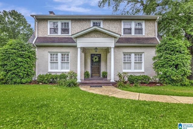 102 E Crest Rd, Hueytown, AL 35023 - view of front of house featuring a front lawn and brick siding